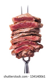 Slices Of Steak On A Meat Fork