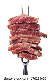 Slices Of Steak On A Meat Fork 