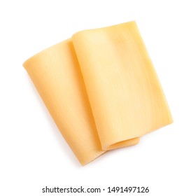 Slices Of Tasty Cheese On White Background, Top View