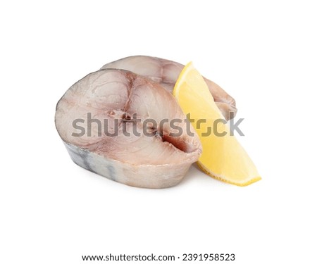 Slices of tasty salted mackerel and lemon wedge isolated on white