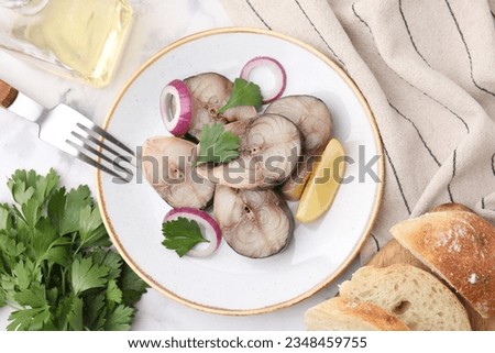 Slices of tasty salted mackerel served on white table, flat lay