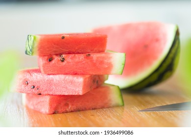 Slices of watermelon on a wooden table, closeup of sliced watermelon, UK