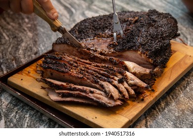 Slicing A Beef Brisket Fresh Off Of The Smoker