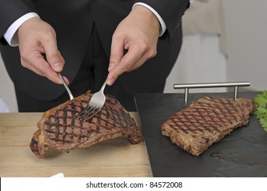 Slicing An Entrecôte On A Carving Table