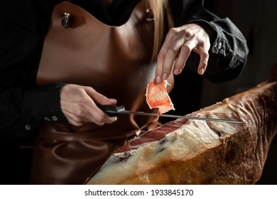 Slicing Spanish jamon iberico. Spanish jamon and traditional food.