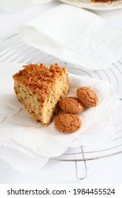 Slide Of Cake With Amaretti. Italian Sweet Cake. Rustic And Traditional Cake On White Napkin