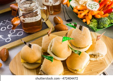 Sliders With Veggie Tray On The Table For The Football Party.