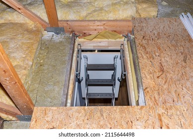 Sliding Metal Stairs To The Attic In The Ceiling, Open Flap And Unfolded Stairs, Modern Look. View From The Top Of The Stairs Down.