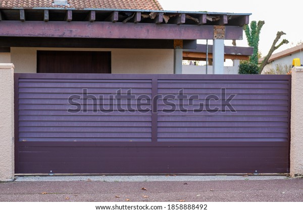 sliding portal street suburb home\
brown dark metal aluminum house gate garden access\
door