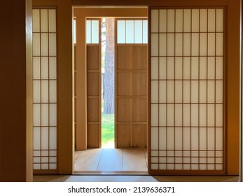 Sliding wooden doors lined with white washi paper in traditional Japanese interior