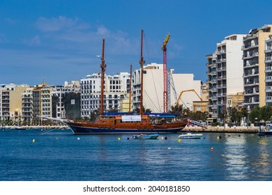 Sliema, Malta - June 10th 2016: Large Sail Boat Moored In Marsamxett Harbour, Overlooked By Apartment Buildings.