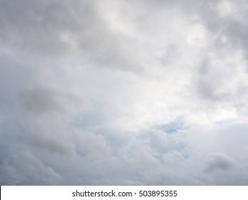 Slight blue sky in between the clouds on dark background - Shutterstock ID 503895355