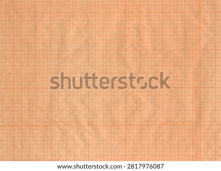 Slightly crumpled graph paper for drafting with orange millimeter grid as paper backgrounds or wallpapers with high detail texture.	