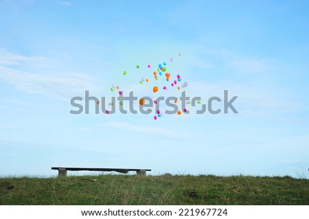 Slightly defocused image of wooden bench on hill with copy space for text