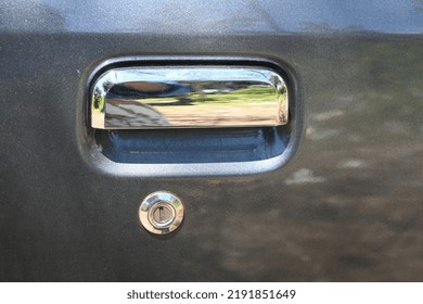 Slightly Dusty Gray Car Door Handle