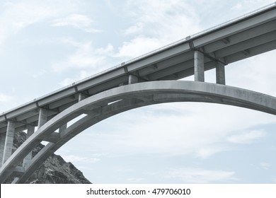 Slightly Stylised And Close Up Section From Below Of The Hoover Dam Bridge Over The Colorado River.