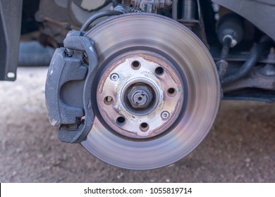 Slightly Worn Brake Disc And Wheel Hub Of A Car In Detail