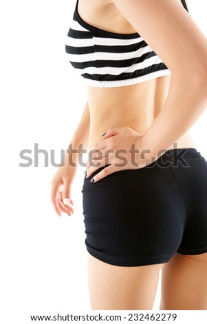 Slim around the waist of a woman on white background