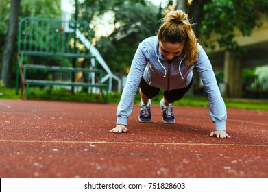 Slim Beautiful Athletic Woman Doing Pushup Exercise.