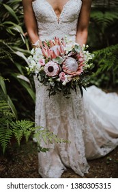 Slim bride holding australian native flower bouquet  - Shutterstock ID 1380305315