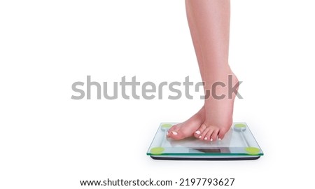 Slim caucasian girl standing barefoot on wheights isolated on white background 