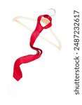 Slim fit red tie hanging on white background close-up view 