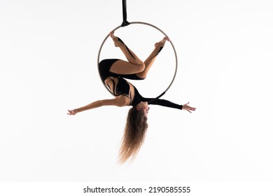 Slim and flexible circus Girl In aerial hoop isolated On White Background