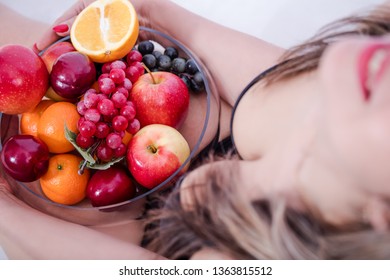 Slim girl and fruit. Fruit diet. Good figure. Apples.
