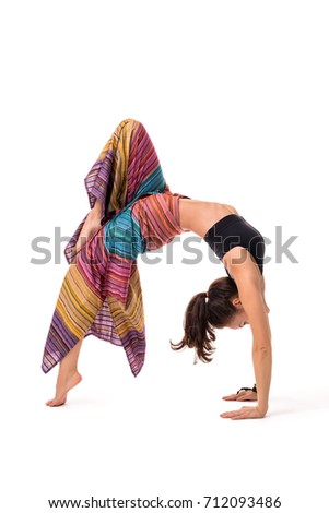 Slim girl practising yoga isolated on white