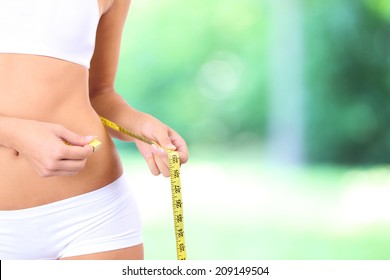 Slim Girl With Tape On Bright Background