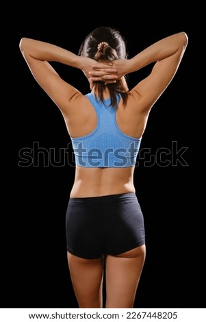 Similar – Rear view portrait of one young middle age athletic woman at crossfit training, exercising with trx suspension fitness straps over dark background