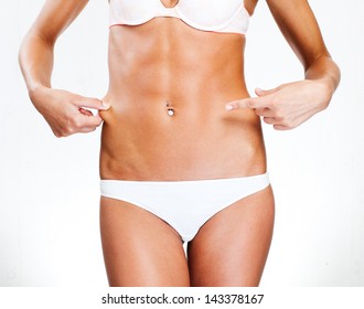 Slim tanned woman's body