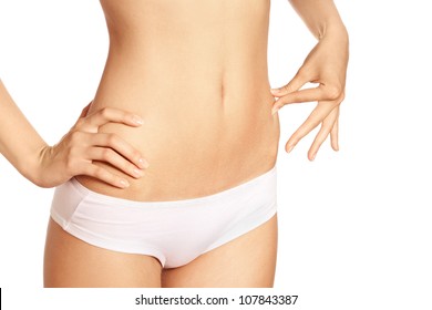 Slim tanned woman's body isolated over white background. Healthy lifestyles concept.