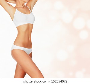 Slim woman against abstract background with circles and copyspace 