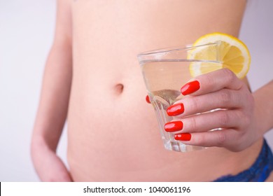 Slim Woman Drinking Clear Water With Lemon To Boost Up Metabolism. Dieting, Wellness, Health Care And Lifestyle