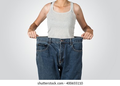 Slim Woman Pulling Oversize Jeans, Weight Loss Isolated Project