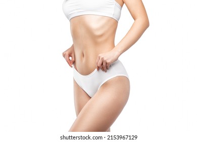 Slim Woman In White Lingerie. The Concept Of Proper Nutrition And A Healthy Lifestyle.