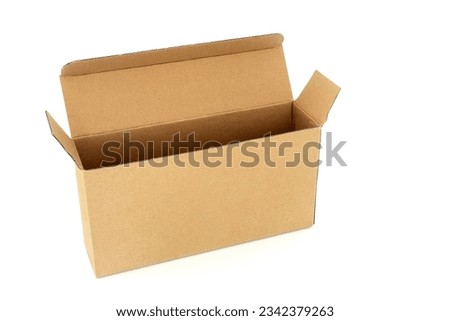 Slimline brown cardboard rectangular shape box on white background. Environmentally friendly recycled reusable material for delivery parcel package.