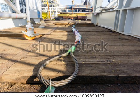 A sling wire with thimble eye termination, laid on the deck of construction barge, to be used for heavy lifting