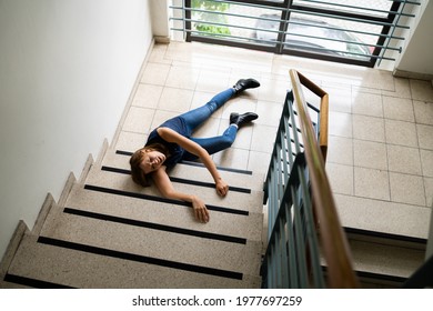 Slip And Fall Accident On Stairs. Worker Woman Fallen Down