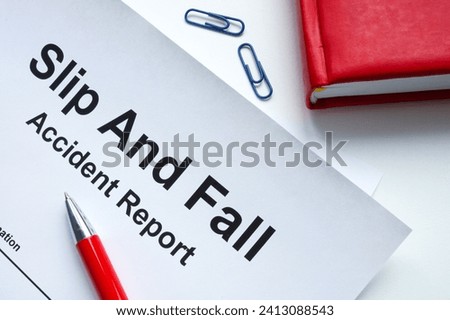 Slip and fall accident report and notepad.