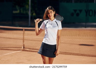 Slip Type Of Body. Female Tennis Player Is On The Court At Daytime.