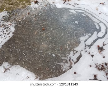 Slippery Black Ice On Asphalt Or Pavement