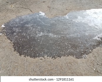 Slippery Black Ice On Asphalt Or Pavement