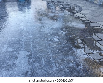 Slippery Black Ice On Walkway - Winter Season