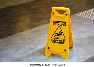 Slippery Floor Surface Warning Sign  And Symbol In Building, Hall, Office, Hotel , Restaurant, Restroom. Concept Photo Danger.No People. Copy Space