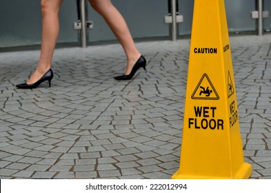 Slippery Floor Surface Warning Sign And Symbol In Building, Hall, Office, Hotel , Restaurant, Restroom. Concept Photo Danger.