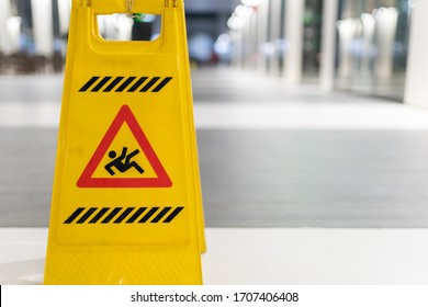 Slippery Sign On Wet Floor In Office Building