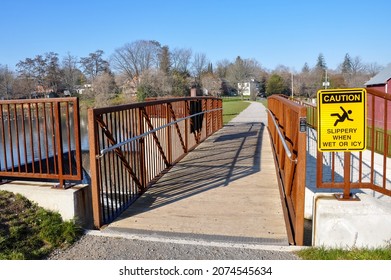 Slippery When Wet Or Icy Sign Posted At The Entrance Of The Bridge