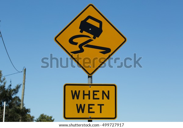 Slippery When Wet, road\
warning. Sign.